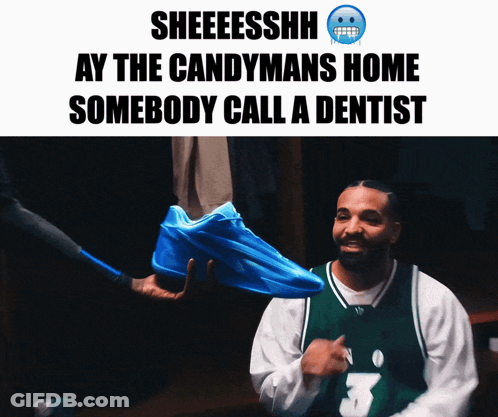 Man In Green Jersey Holding Blue Sneakers GIF