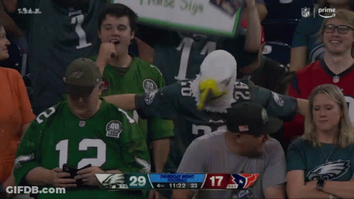 Man In Green Jersey Number 12 In Crowd GIF