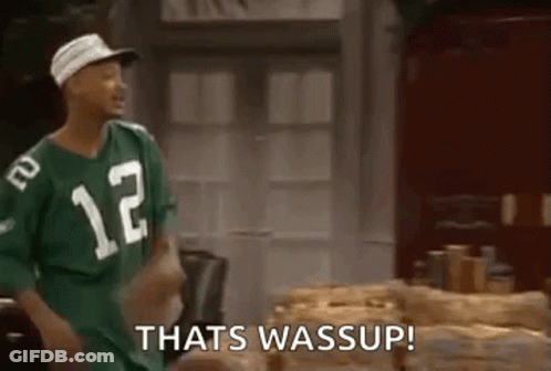 Man In Green Jersey Number 12 Next To Logs GIF