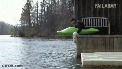 Man In Green Kayak Ready To Jump Into Water GIF