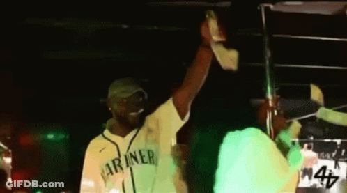Man In Green Mariners Jersey Holding Up Hand GIF