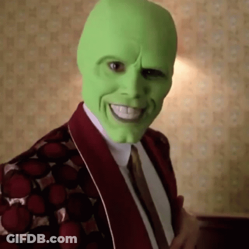 Man In Green Mask And Red Jacket Smiling GIF