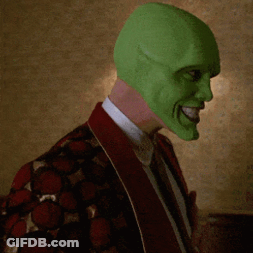 Man In Green Mask And Red Jacket Smiling GIF