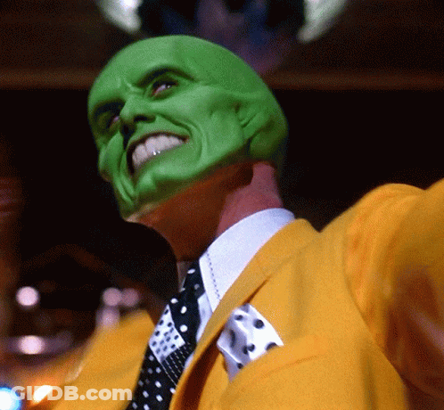 Man In Green Mask And Yellow Jacket With Tie GIF