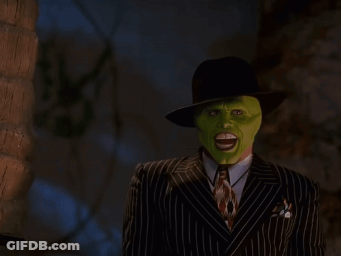 Man In Green Mask Blowing Smoke GIF