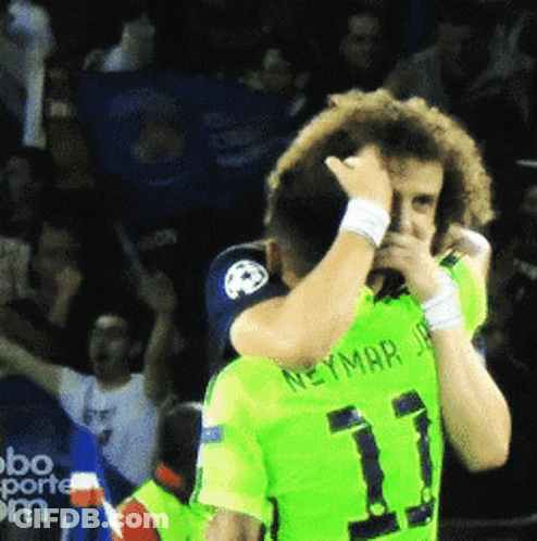 Man In Green Neymar Jersey Wiping Face GIF