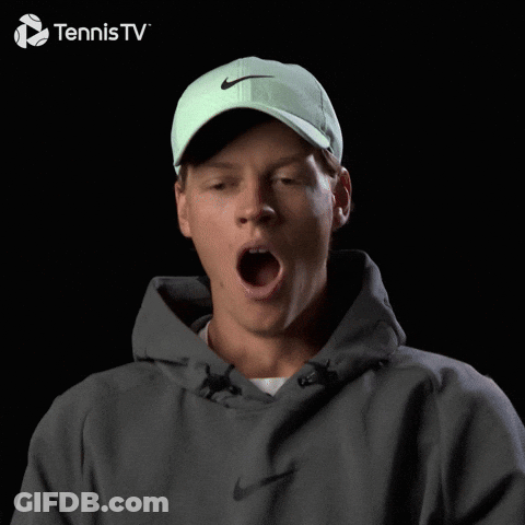 Man In Green Nike Hat And Grey Hoodie Smiling For Tennis TV GIF