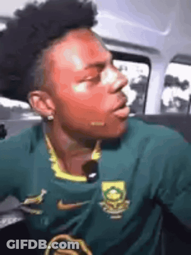 Man In Green Nike Jersey Sitting In Car GIF
