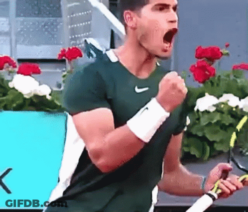 Man In Green Nike Shirt Celebrating Tennis Racquet GIF