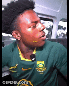Man In Green Nike Shirt Mouth Open In Car GIF