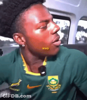 Man In Green Nike Shirt Sitting In Car With Mouth Open GIF