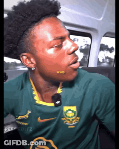 Man In Green Nike Shirt With Who On Cheek GIF