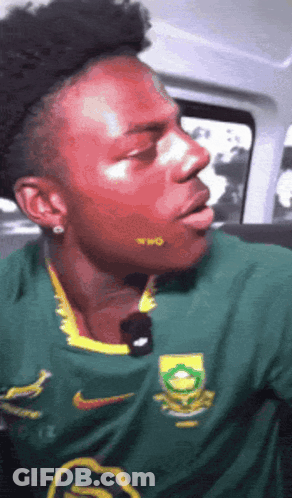 Man In Green Nike Shirt With Yellow Logo GIF