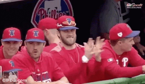 Man In Green Oakland Jersey In Front Of Sign Saying 367 GIF