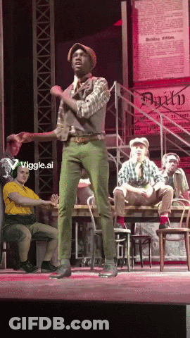 Man In Green Pants On Stage With Faith Sign GIF