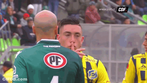 Man In Green PF Jersey Shushing GIF