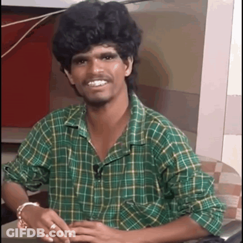Man In Green Plaid Shirt Smiling GIF
