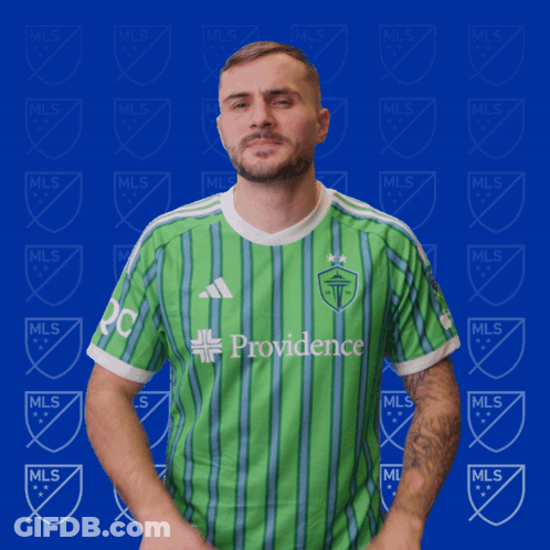 Man In Green Providence Shirt On Blue Background GIF