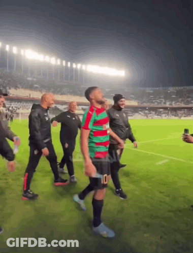 Man In Green Red Jersey Number 10 Shorts GIF