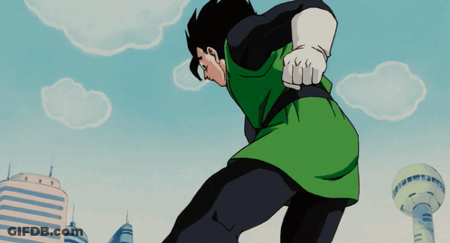 Man In Green Shirt And Black Pants In Front Of City GIF