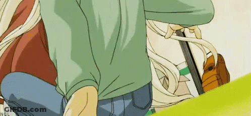 Man In Green Shirt And Blue Jeans Kneeling Next To Blonde Girl GIF