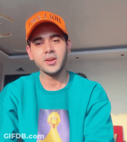 Man In Green Shirt And Orange Oha Jjoh Hat GIF