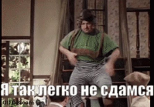 Man In Green Shirt And Striped Pants With Foreign Caption GIF