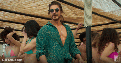 Man In Green Shirt And Sunglasses In Crowd Of Women GIF