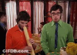 Man In Green Shirt And Tie Smoking Cigarette GIF