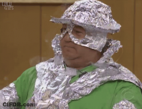 Man In Green Shirt And Tin Foil Hat GIF