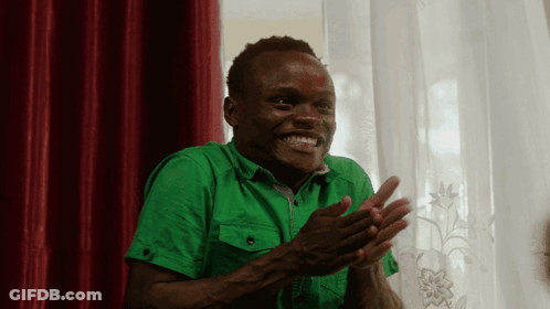 Man In Green Shirt Clapping Hands Red Curtain GIF