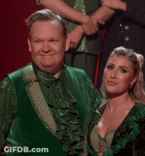 Man In Green Shirt Covering Mouth GIF