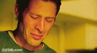 Man In Green Shirt Crying Eyes Closed Mouth Open GIF