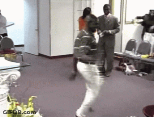 Man In Green Shirt Dancing In Hallway GIF