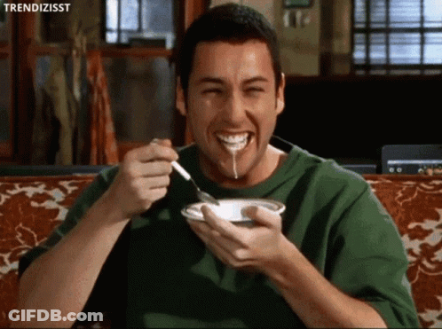 Man In Green Shirt Eating And Smiling GIF