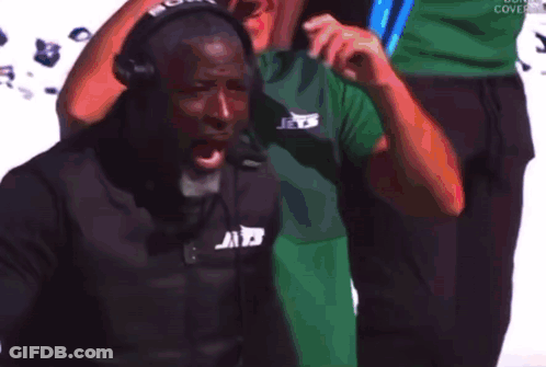 Man In Green Shirt Holding Blue Lights GIF