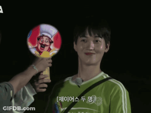 Man In Green Shirt Holding Cartoon Chef Box GIF