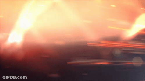 Man In Green Shirt Holding Football On Field GIF