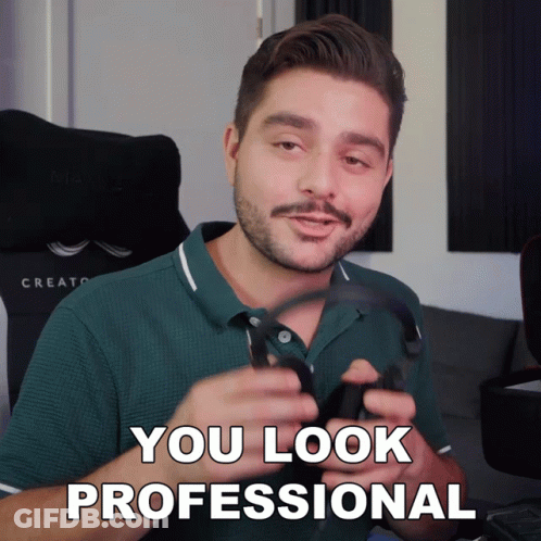 Man In Green Shirt Holding Headphones Says You Look Professional GIF