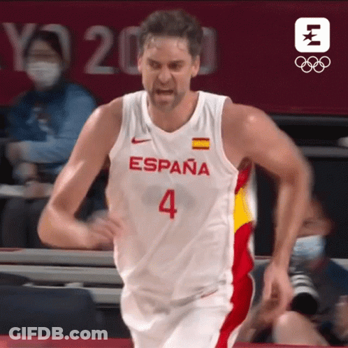 Man In Green Shirt Holding Red Card In Crowd GIF