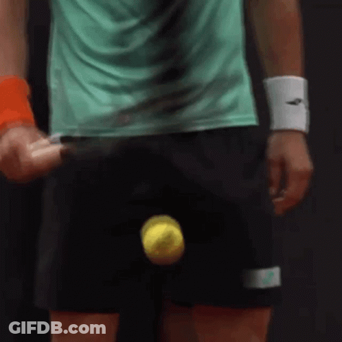 Man In Green Shirt Holding Tennis Racket And Ball GIF