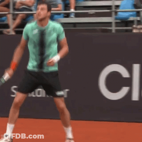 Man In Green Shirt Holding Tennis Racquet GIF