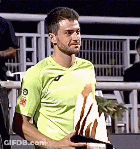 Man In Green Shirt Holding Trophy With HC Sticker GIF