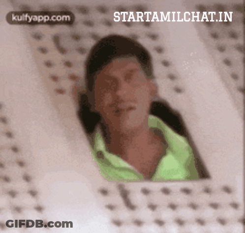Man In Green Shirt Looking Out Window GIF