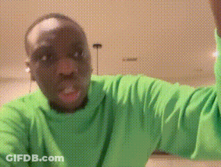 Man In Green Shirt Making A Face GIF