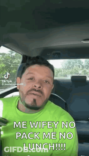 Man In Green Shirt Making Face In Car GIF