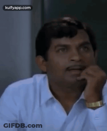 Man In Green Shirt Making Funny Face GIF