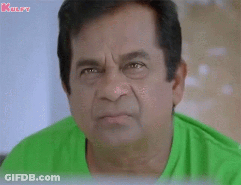Man In Green Shirt Making Funny Face GIF