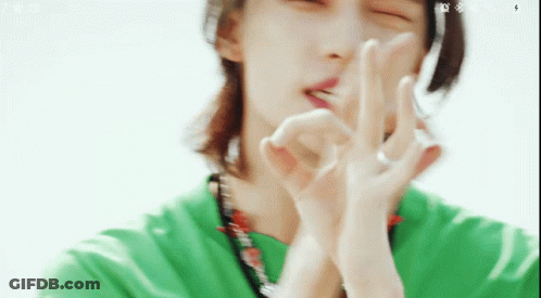 Man In Green Shirt Making Peace Sign GIF