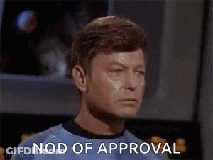 Man In Green Shirt Nods Approval GIF